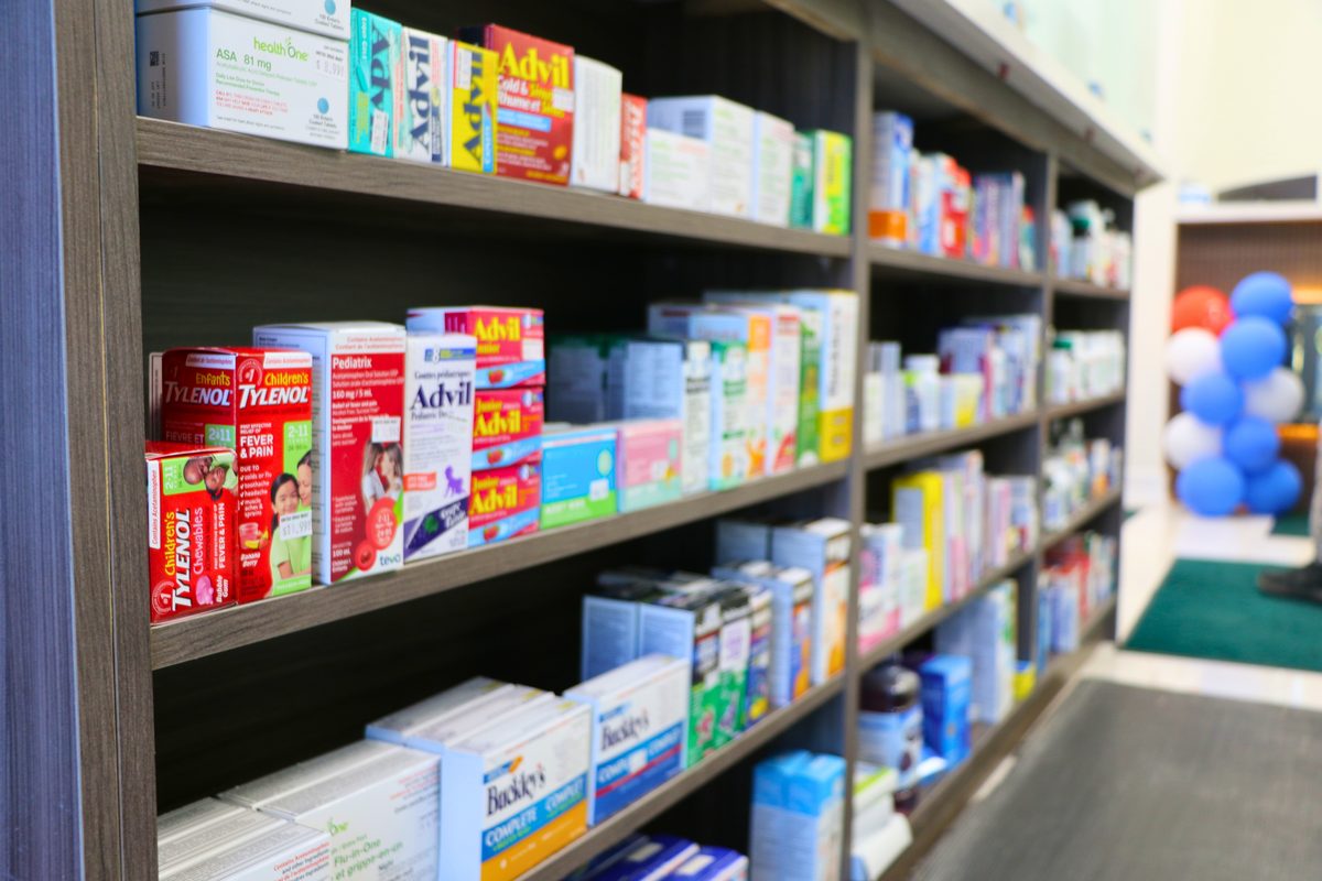 On-site pharmacy shelves stocked with medications